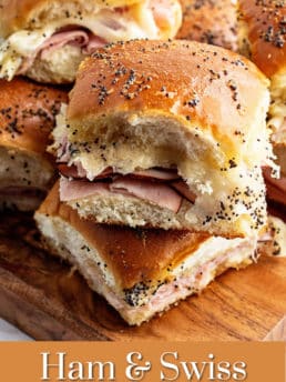 slider sandwiches stacked on wood tray