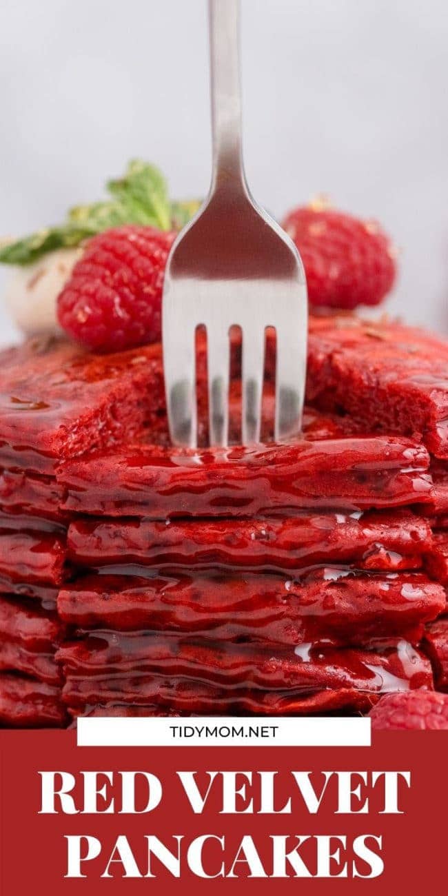 a stack of red pancakes with a form stabbing in them