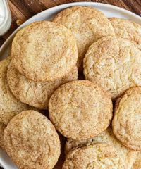 snickerdoodles piled on a white platter