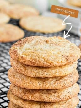 Six cookies in a stack on a wire cooling rack