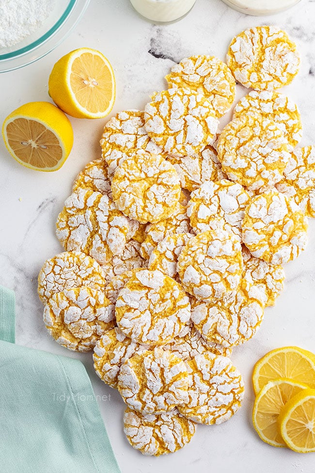 lemon cookies scattered on a counter
