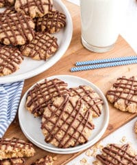 overhead shot of cookies with chocolate drizzle on a plate