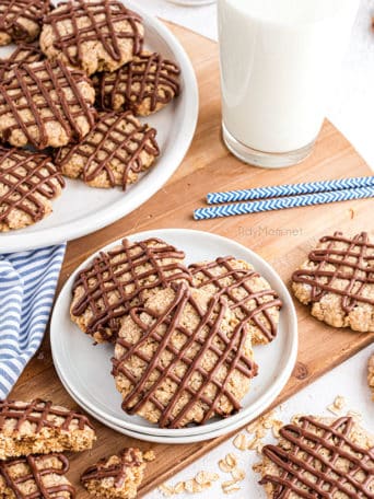 overhead shot of cookies with chocolate drizzle on a plate