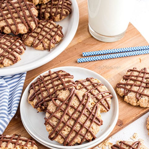 overhead shot of cookies with chocolate drizzle on a plate
