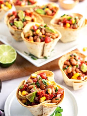 texas caviar in baked tortilla cups on a plate