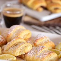 lemon cheesecake crescent rolls with a cup of coffee