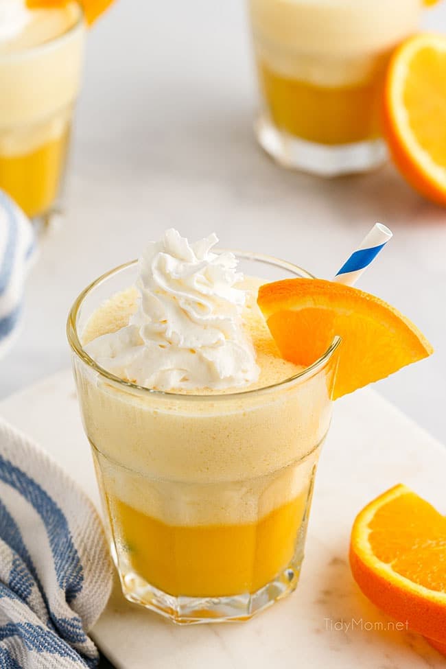 a glass fill with an Orange Julius and topped with whipped cream