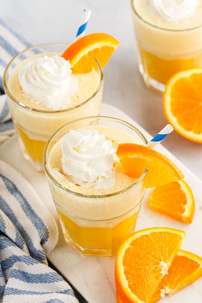 2 glasses of orange Julius on a counter