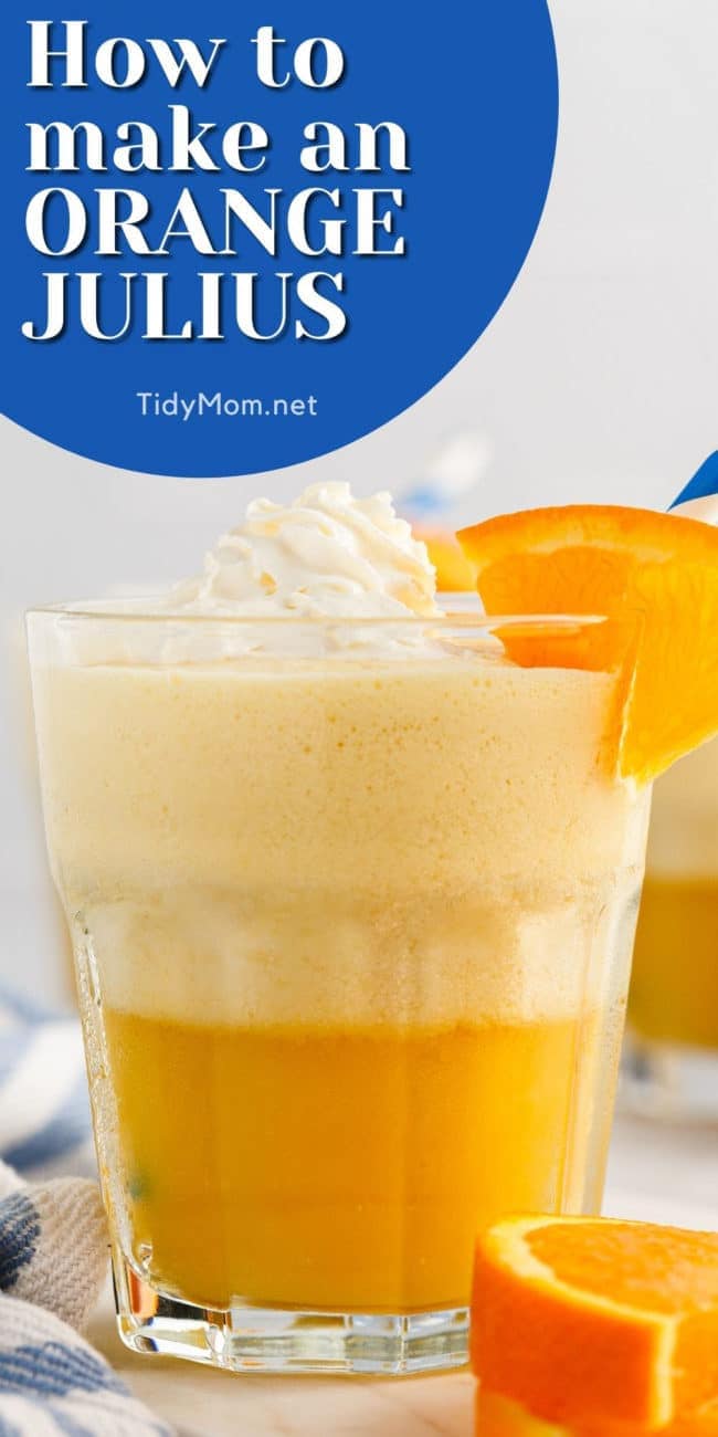 a glass with an orange julius on a counter
