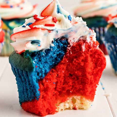 red white and blue cupcake with bite taken out