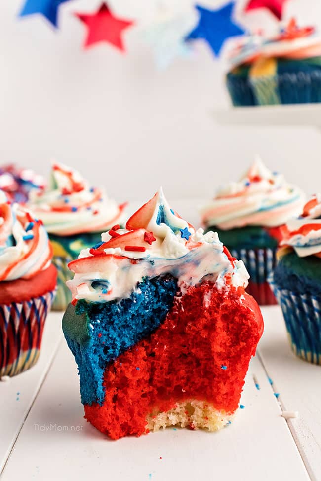 red white and blue cupcake with a bite missing.