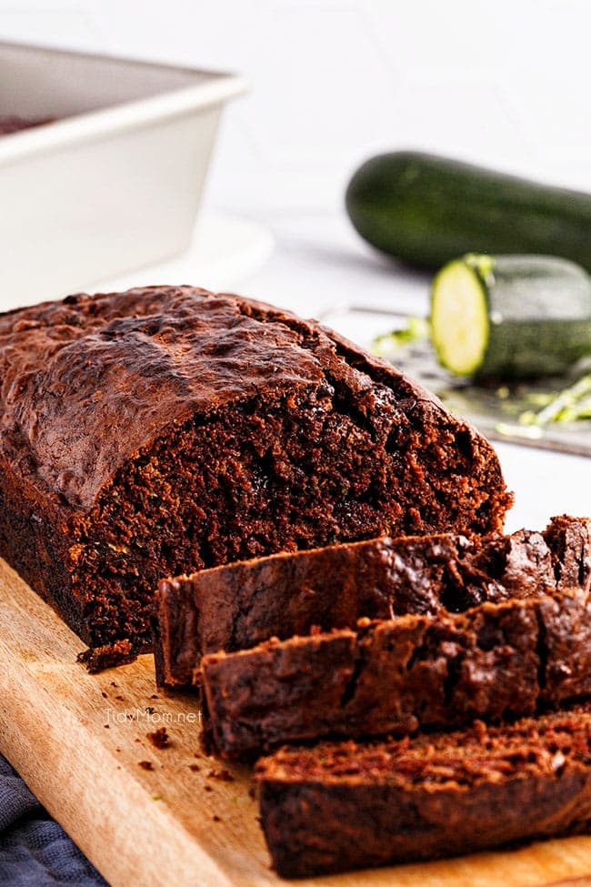 sliced loaf of chocolate zucchini bread on a cutting board