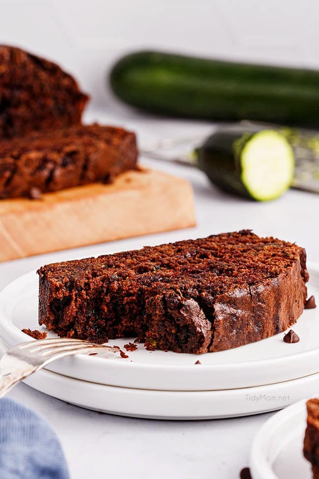 a slice of chocolate zucchini bread on a white plate