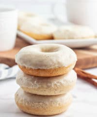 a stack of glazed cinnamon donuts