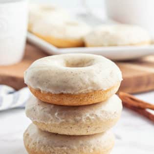a stack of glazed cinnamon donuts