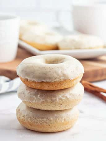 a stack of glazed cinnamon donuts