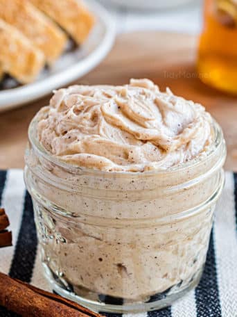 jar of honey butter on striped towel