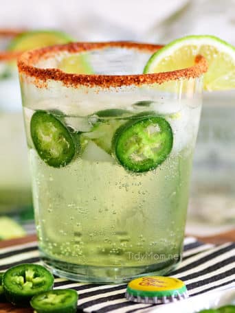 spicy ranch water in a glass with a chili lime rim