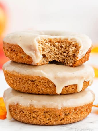 stack of three glazed apple cider donuts