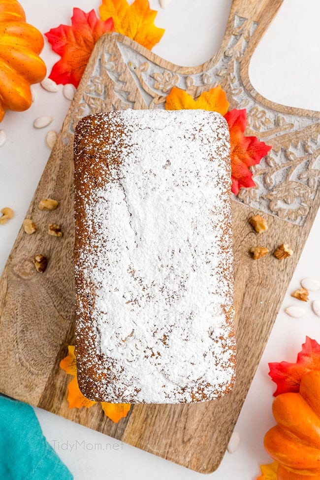 loaf of pumpkin bread dusted with powdered sugar on top