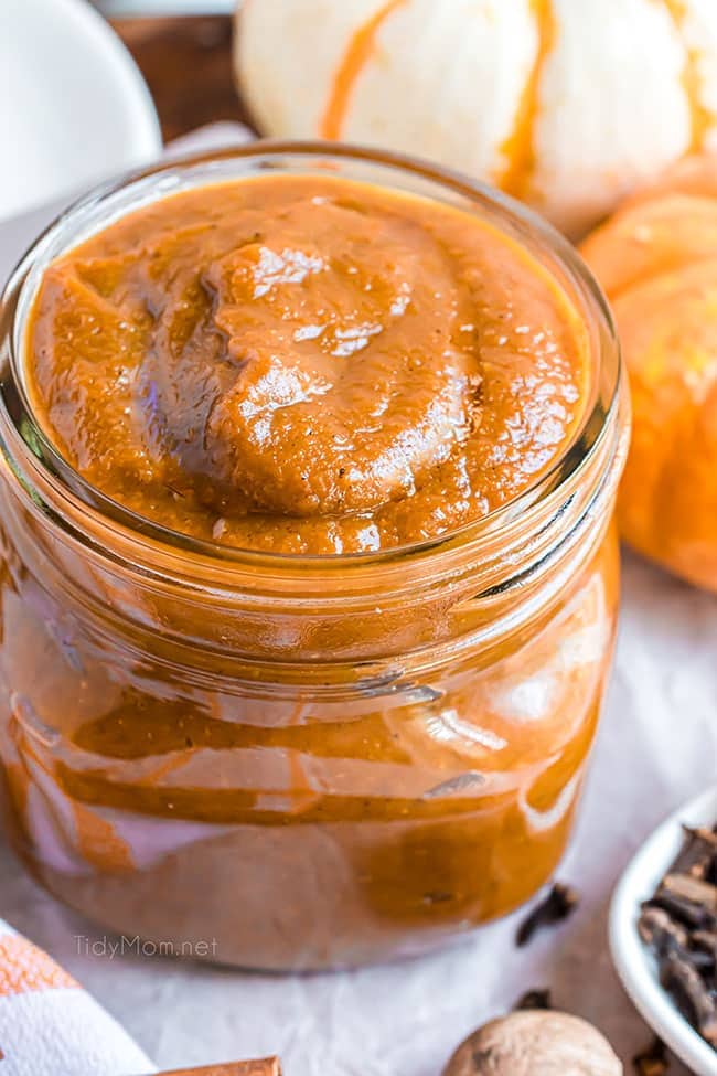 Homemade pumpkin butter in a jar on a counter