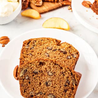 two slices of cinnamon apple bread on a plate
