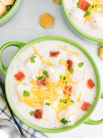 Homemade creamy bacon potato soup in a green bowl