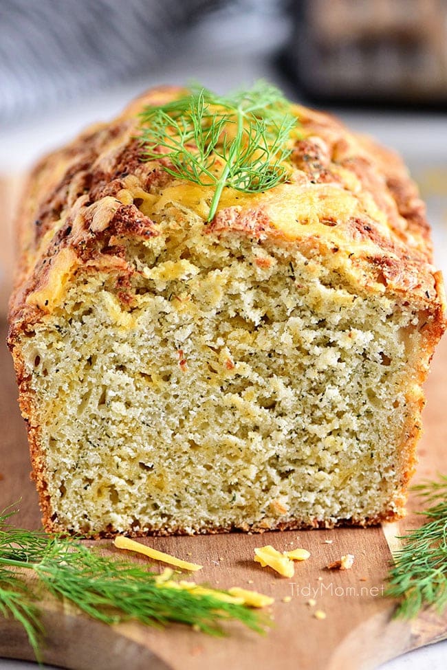 loaf of dilly cheese bread with fresh dill garnish