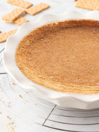 Classic graham cracker crust in a white pie plate