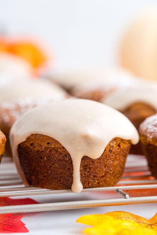 pumpkin muffin with maple glaze dripping off the top