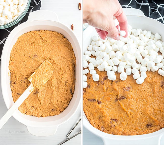 sweet potato casserole in a white serving dish being topped with marshmallows