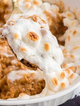 spoonful of sweet potato casserole with marshmallows