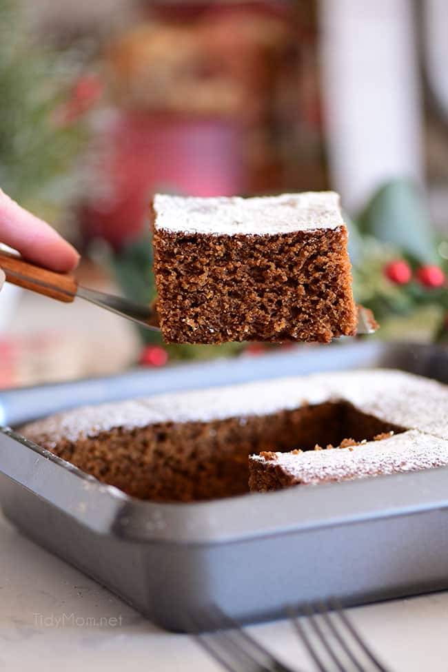 a slice of gingerbread cake coming out of the pan