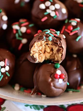 chocolate peanut butter balls with Christmas sprinkles