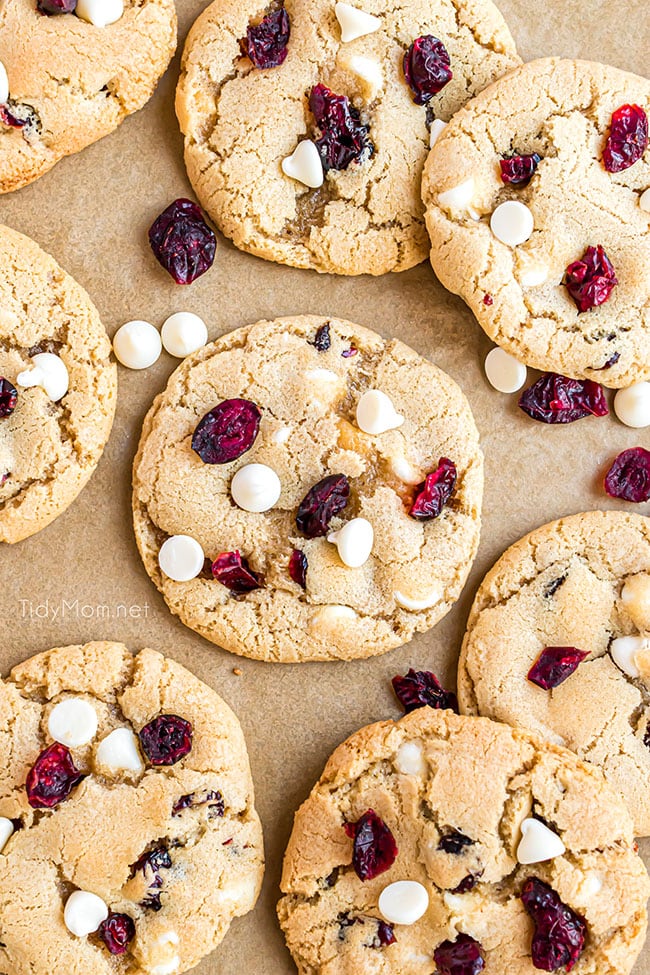 white chocolate cranberry cookies on brown parchment paper