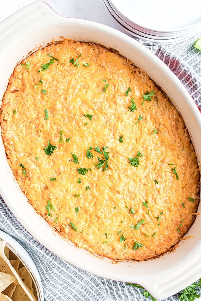 white baking dish with baked buffalo chicken dip