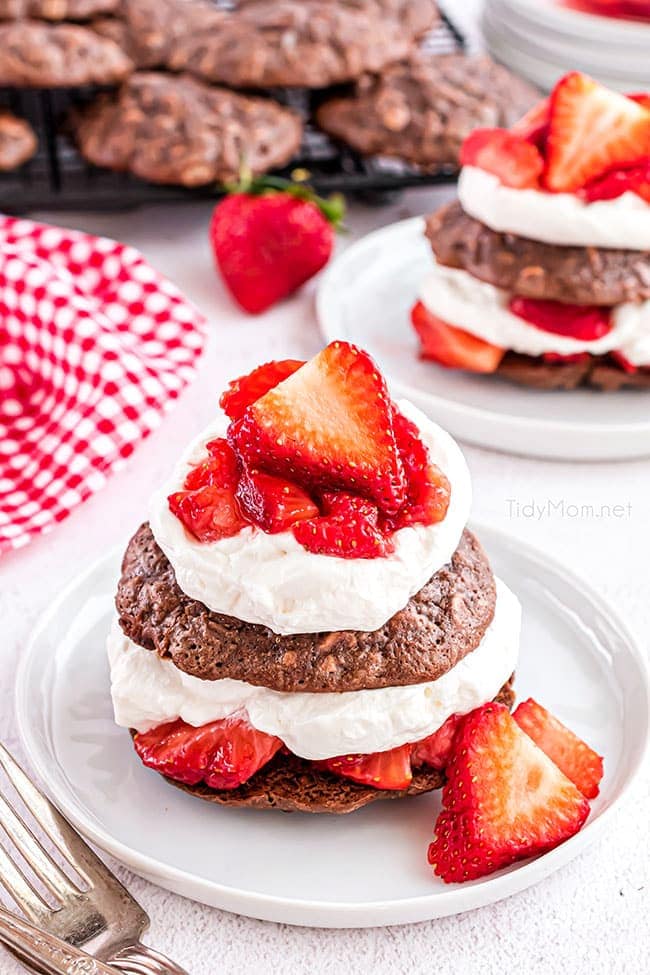 Brownie strawberry shortcake with fresh berries on a white plate