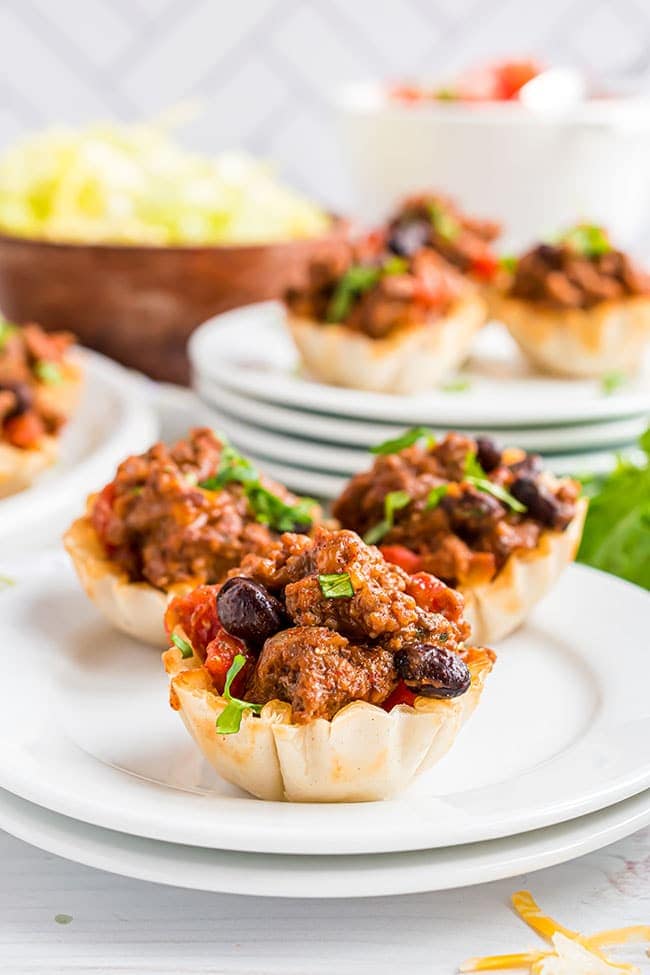 oven-baked phyllo cup taco bites on white plates