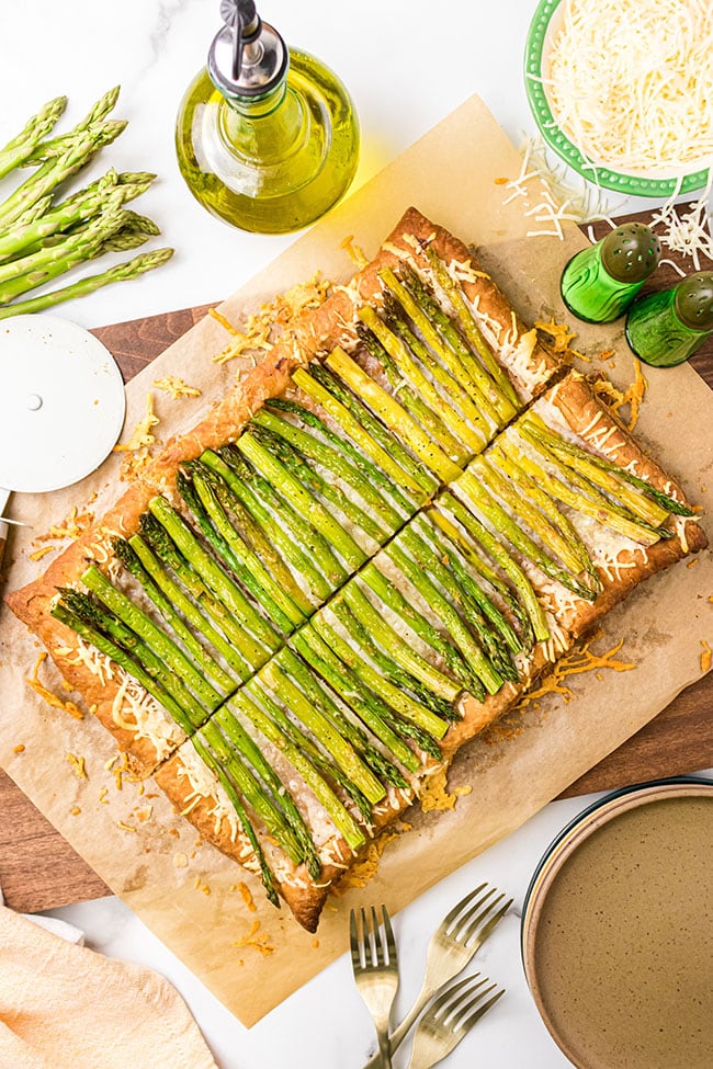 Fresh baked Asparagus gruyere tart on a cutting board