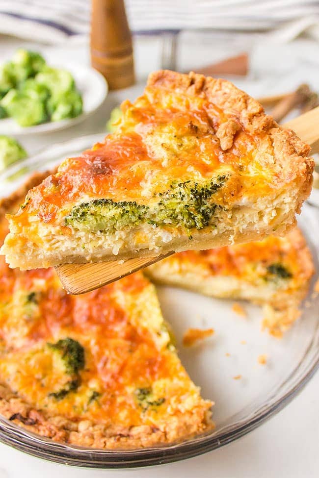 dishing up a serving of broccoli cheddar quiche