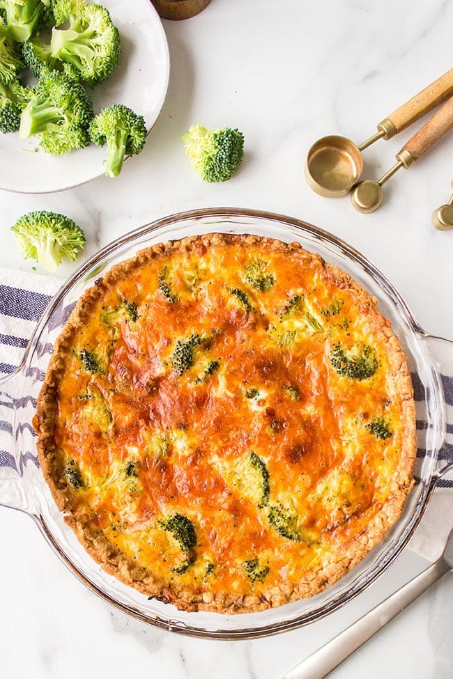 over head shot of broccoli cheddar quiche with frozen pie crust
