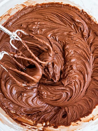 a bowl of chocolate buttercream frosting