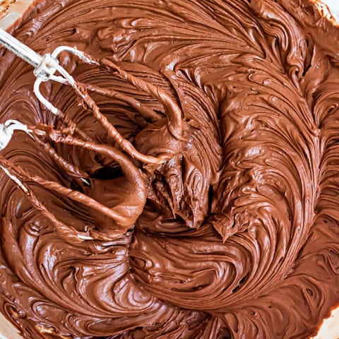 a bowl of chocolate buttercream frosting