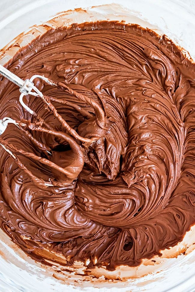 a bowl of chocolate buttercream frosting