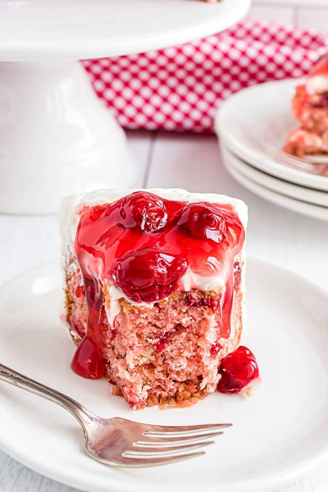 heart shaped cheery cake with bite missing