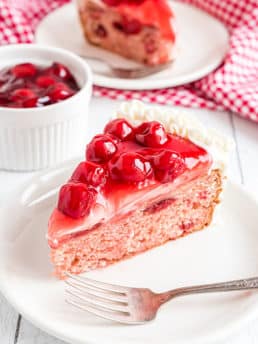 heart shaped cheery cake with cherry pie filling on top