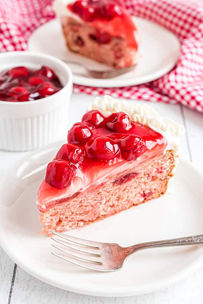 heart shaped cheery cake with cherry pie filling on top