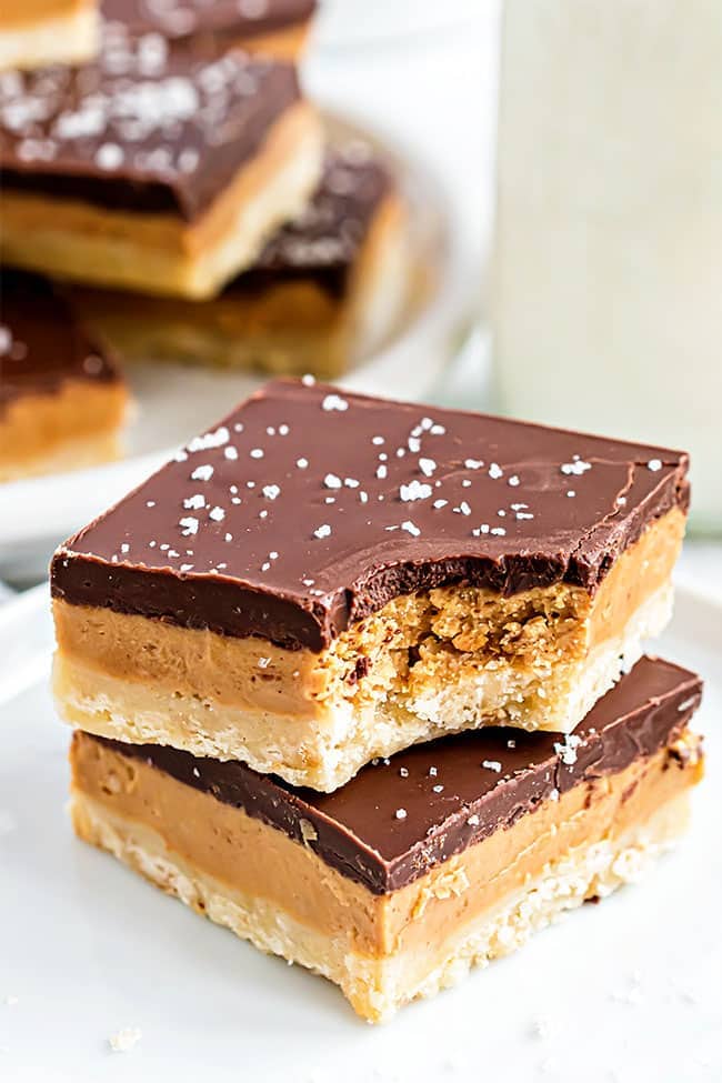 Two Homemade Tagalong cookie bars with a bite out