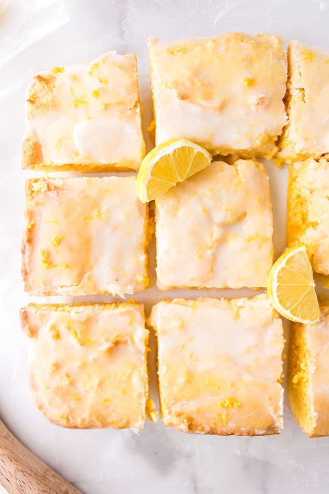 Lemon Brownies with lemon glaze cut into squares