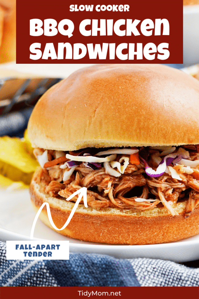 Slow Cooker BBQ Chicken Sandwich on a bun with blue napkin